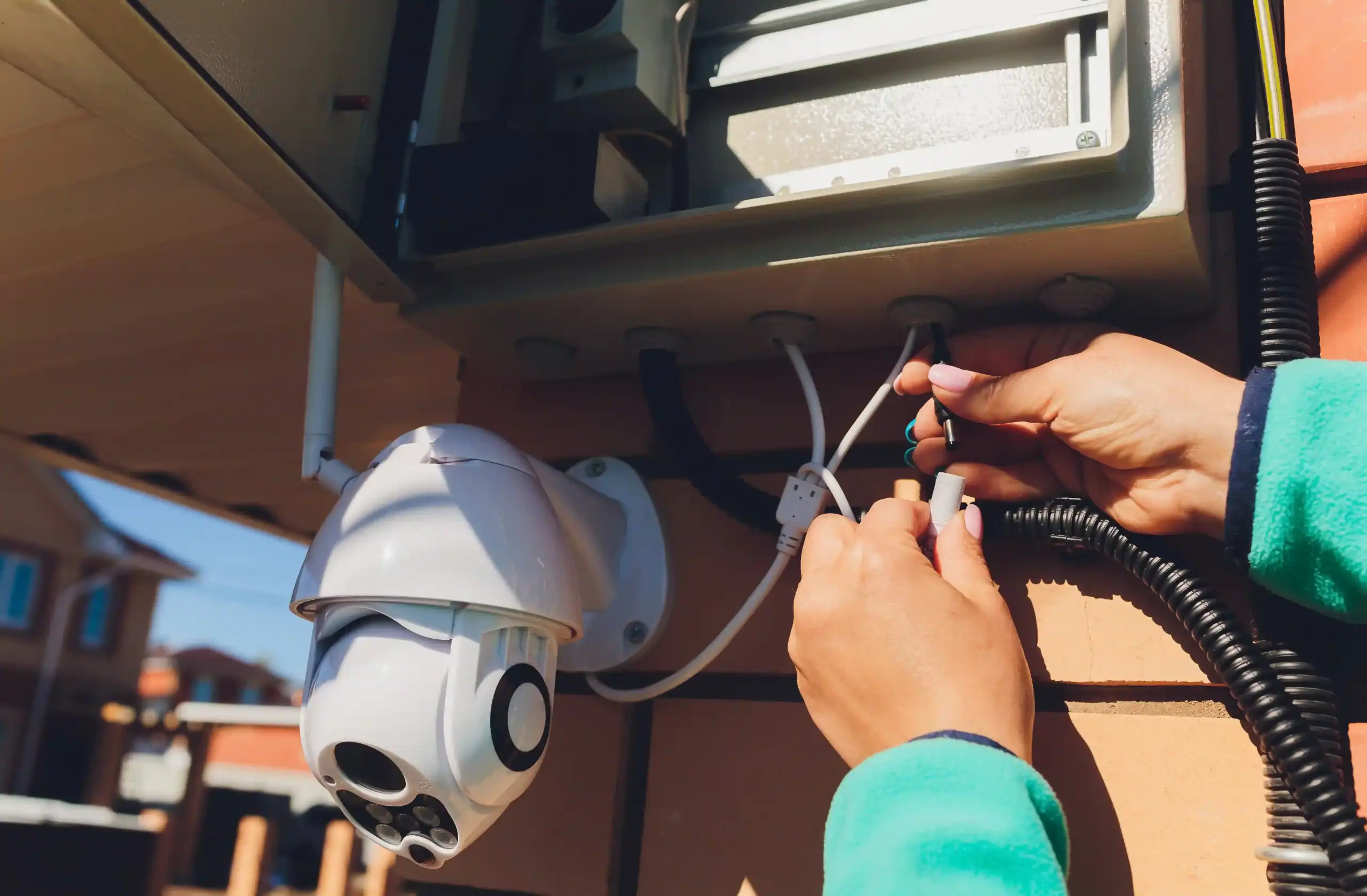 CCTV technician performing security camera maintenance in Dubai